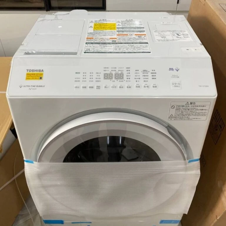 Ảnh chụp thực tế cận cảnh lồng giặt và bảng điều khiển máy giặt Toshiba TW-127XM5L.